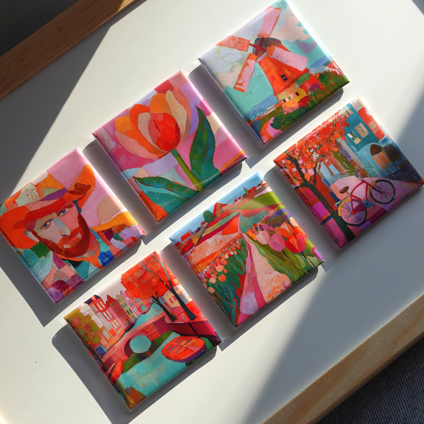 Front view of colorful Amsterdam art magnet set with six hand-painted designs