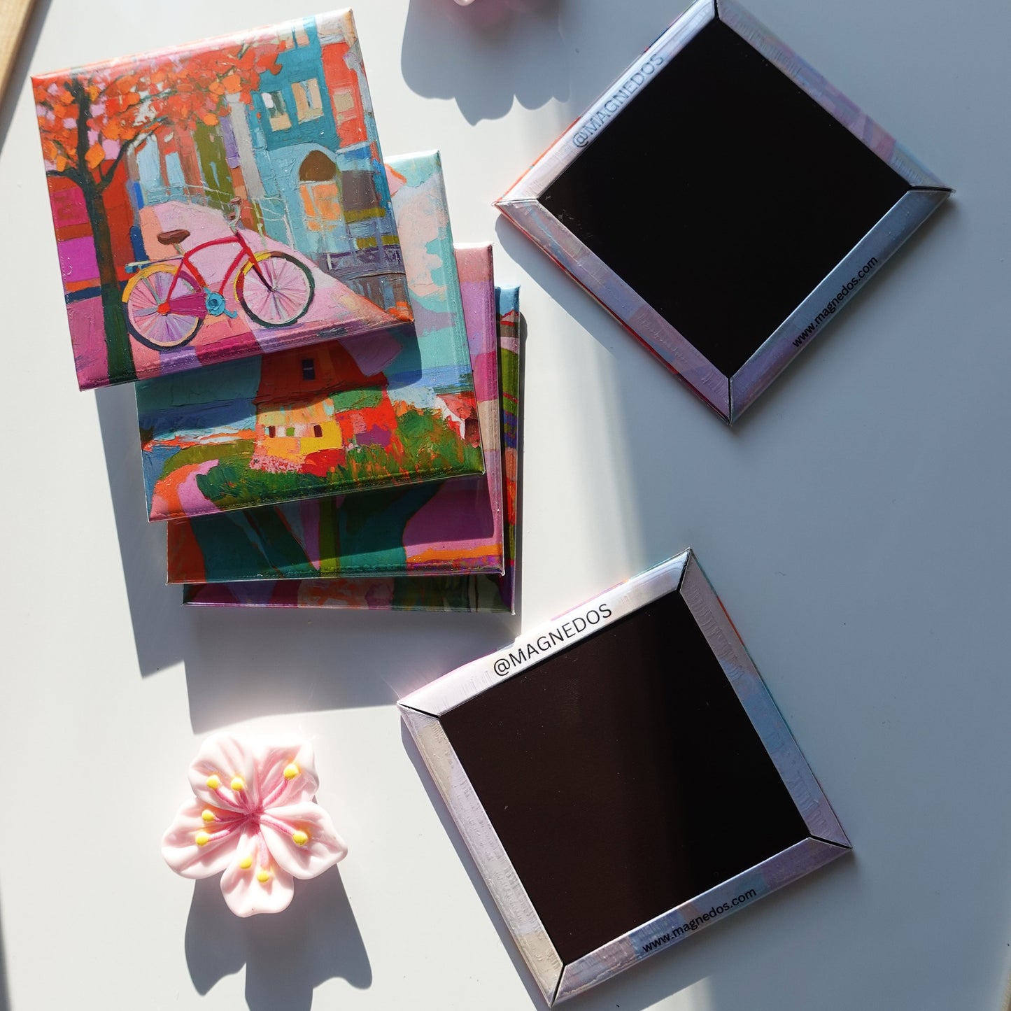 back view of colorful amsterdam fridge magnets with six hand painted designs